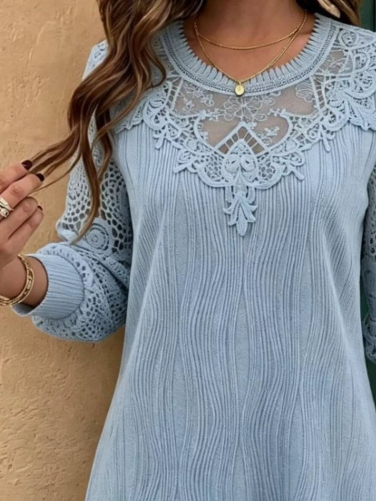 Light blue lace yoke blouse with crochet panel detail and long sleeves with lace cutouts
