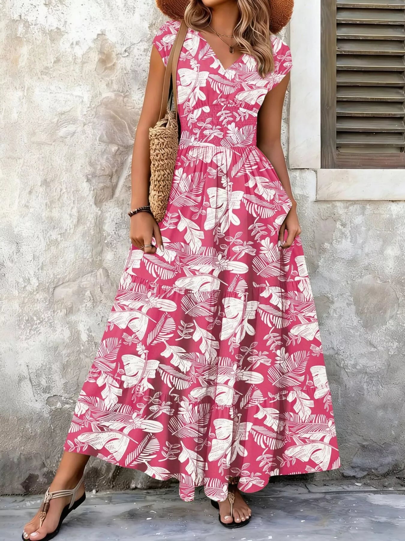 Printed V-neck tiered maxi dress with pink leaf print, sleeveless tiered layers