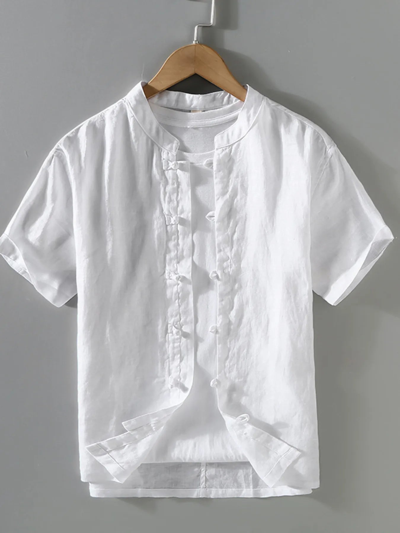 White button-up short-sleeve shirt with band collar and front buttons