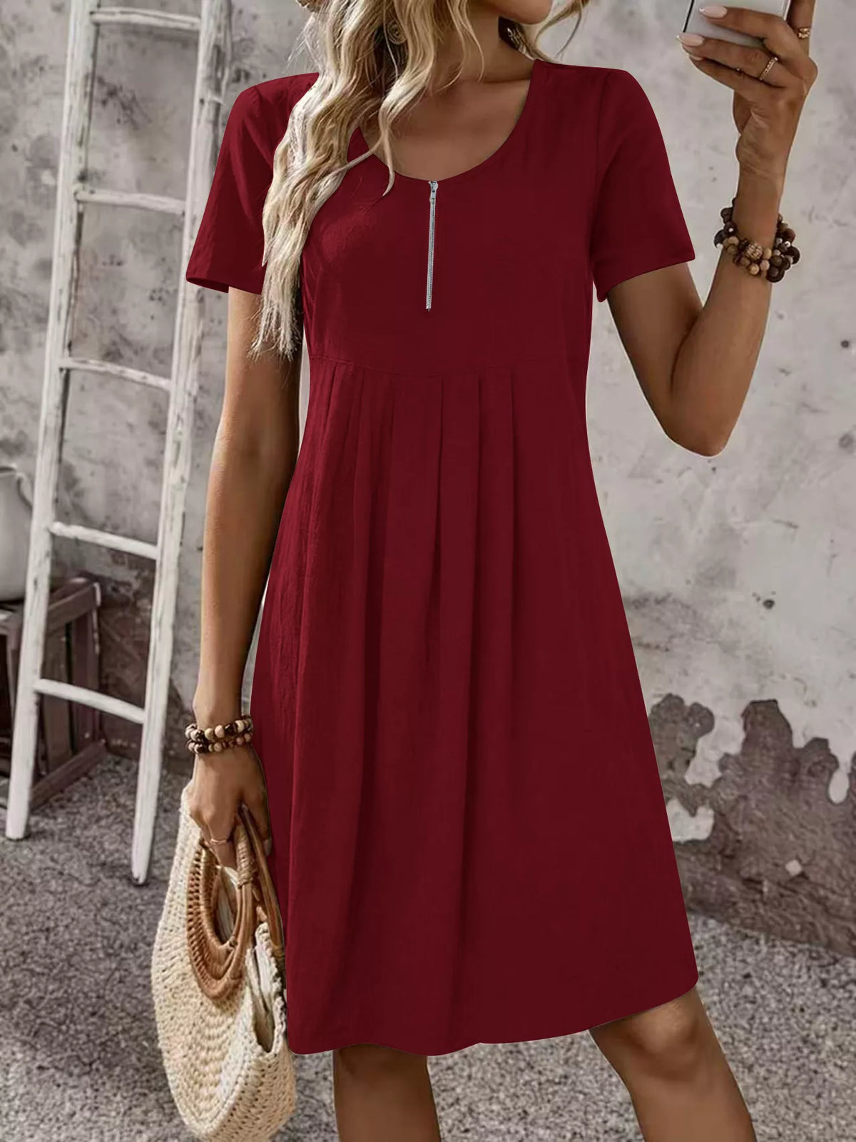 Burgundy red zip-front pleated short-sleeve dress with scoop neckline
