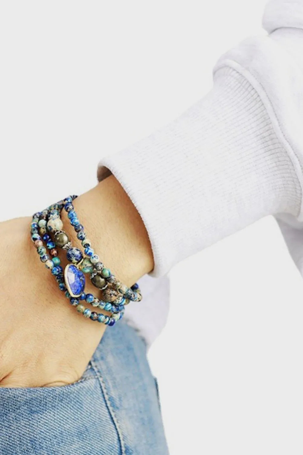 Three-layer beaded bracelet with blue heart charm and royal blue stone beads