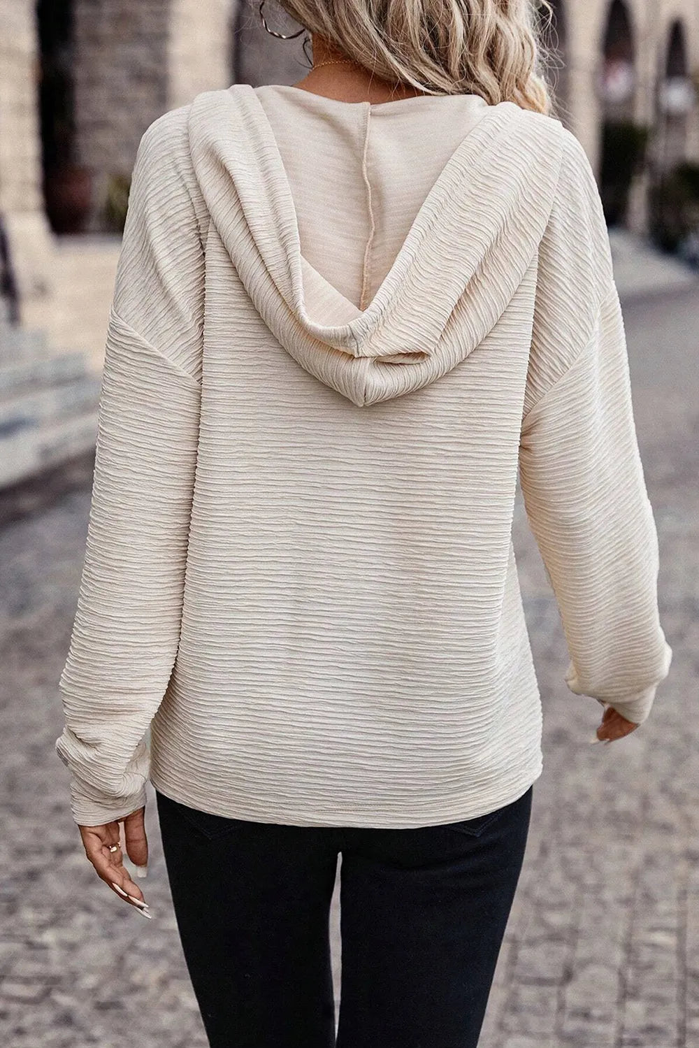 Ivory drawstring hoodie back view with hood and relaxed dropped-shoulder fit