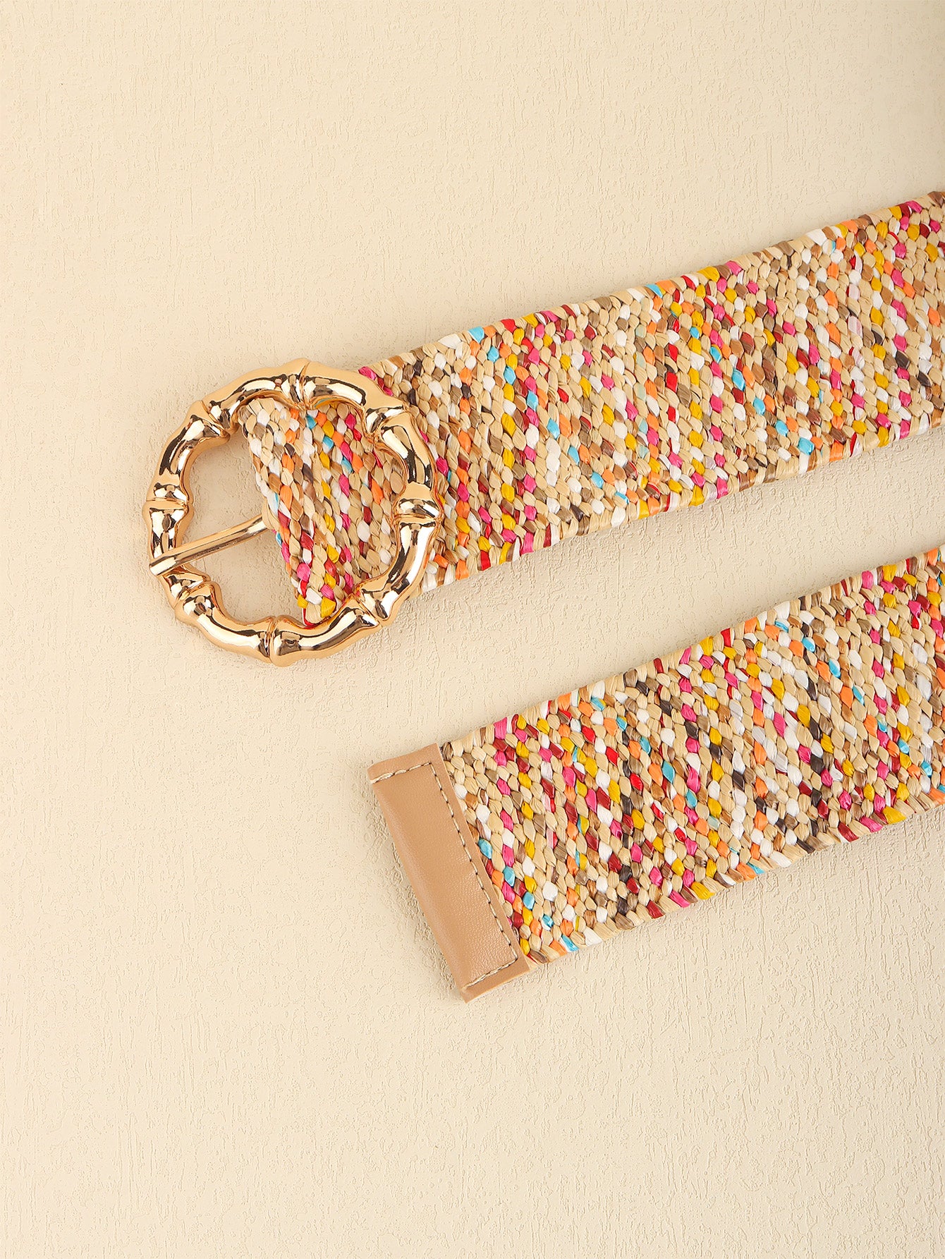 Multicolored wide belt showing gold-toned chain-style buckle and woven weave