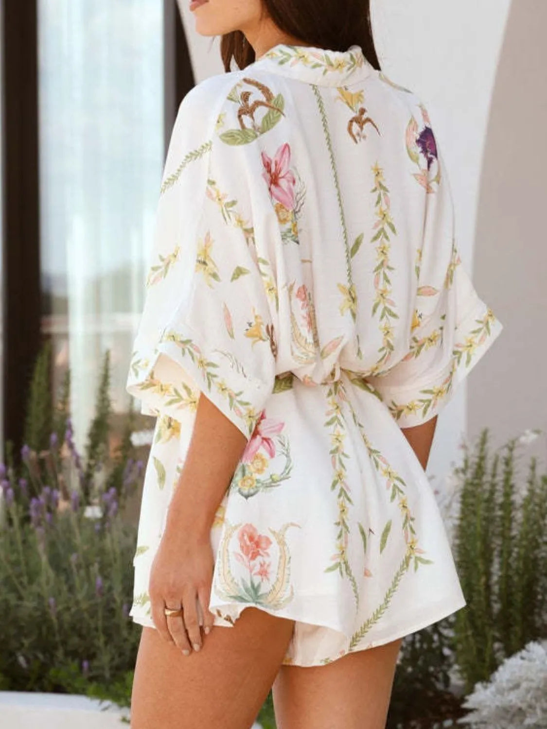 White floral tie-waist romper, half sleeves, gathered waist, back view
