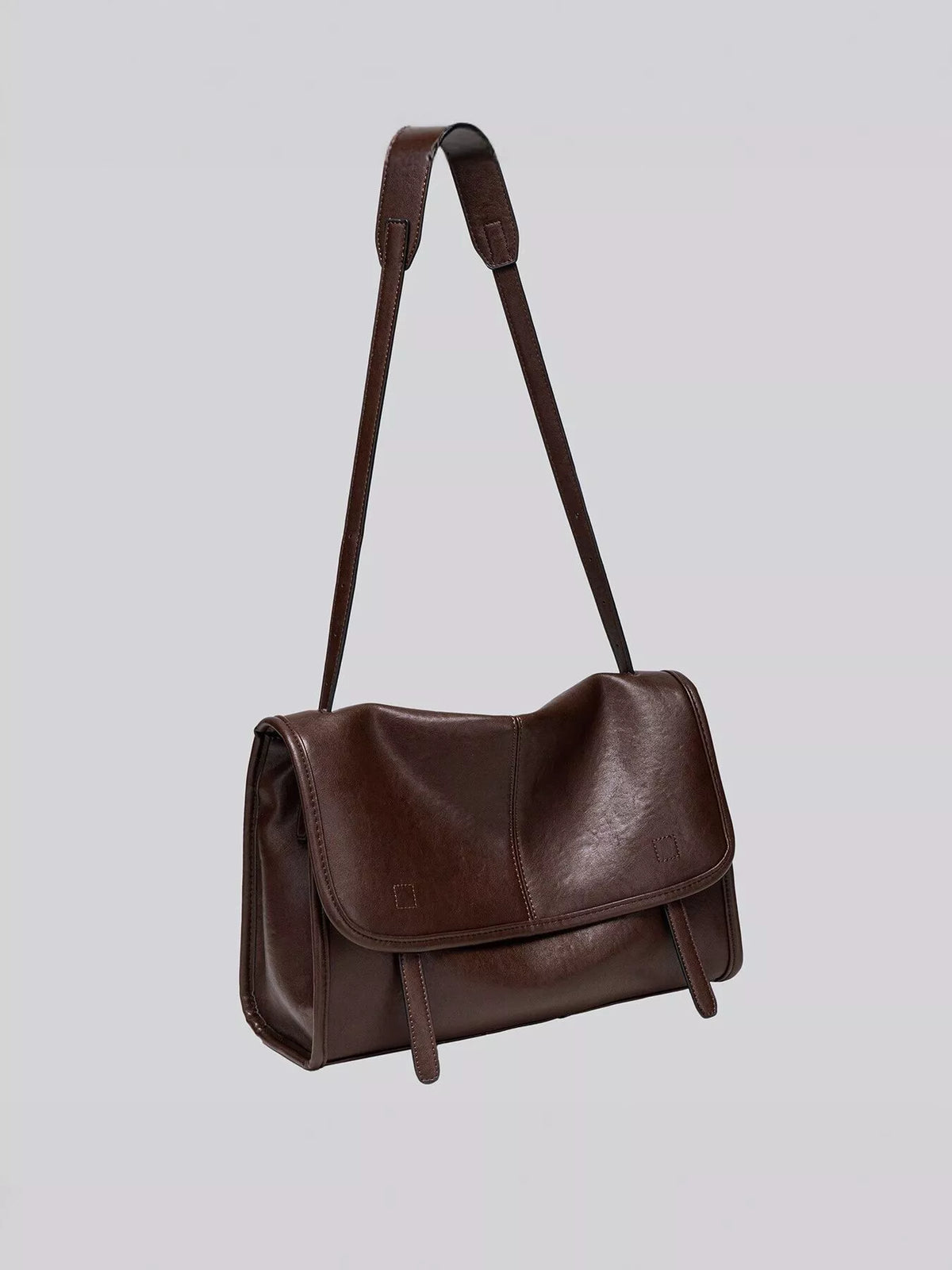 Brown vegan leather shoulder bag with flap front and tall top carrying handles