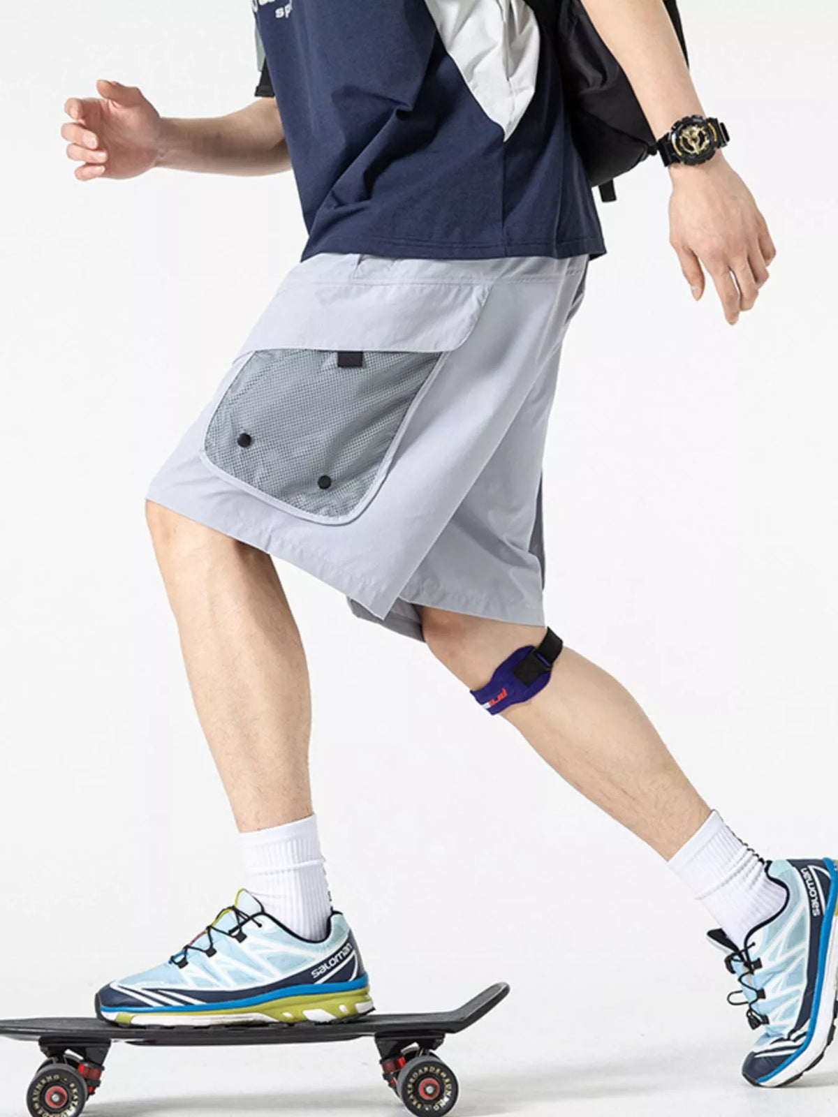 Lightweight quick-dry cargo shorts in cloud gray, side flap pocket detail and straight hem