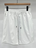 Men's white drawstring casual shorts with elastic waistband and side pockets