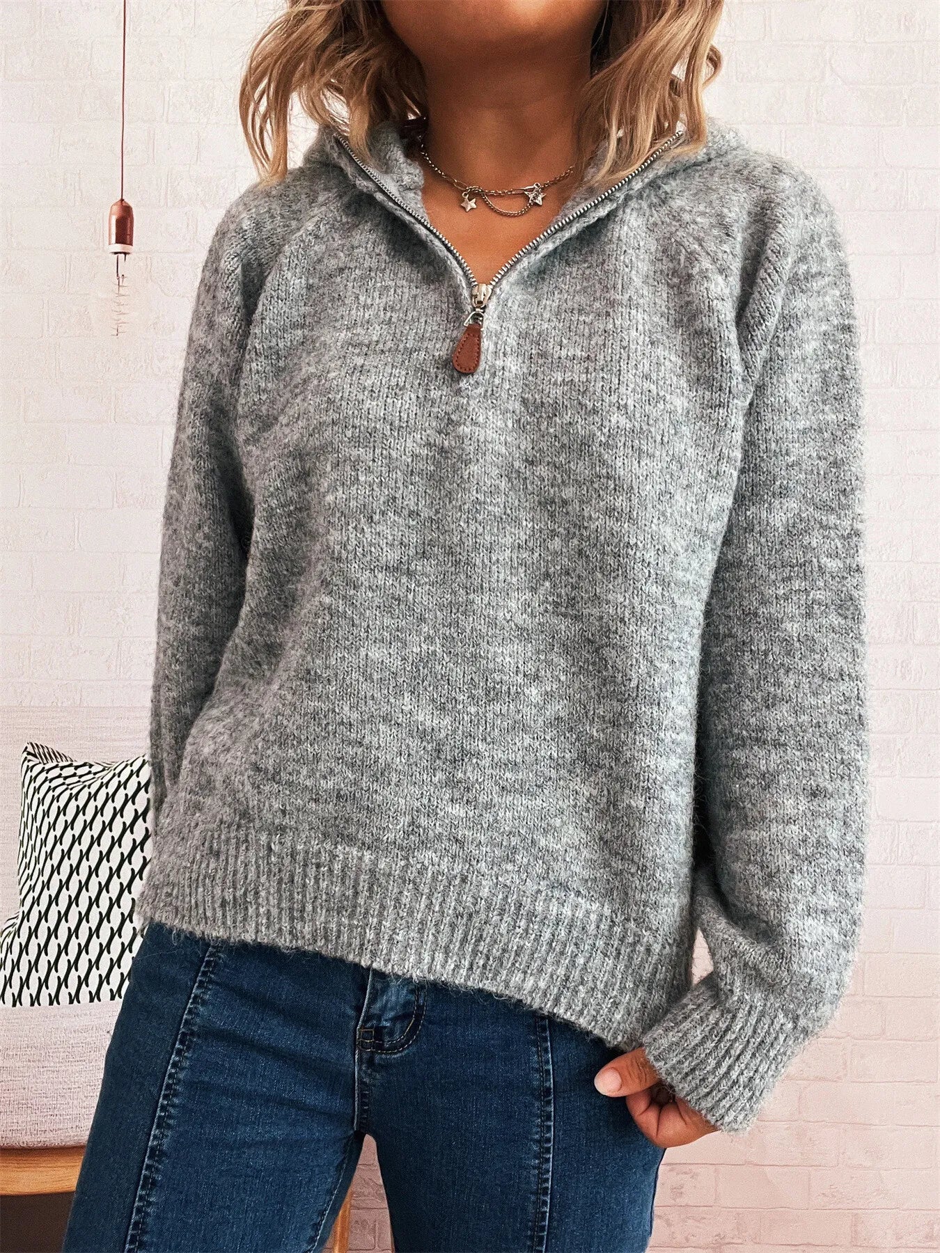 Dark gray quarter-zip knit sweater with ribbed hem and sleeve cuffs