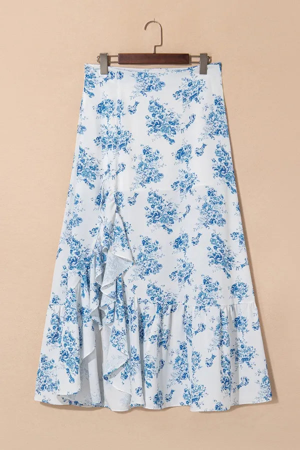 Light blue floral print skirt on hanger with ruffled hem and asymmetrical cut