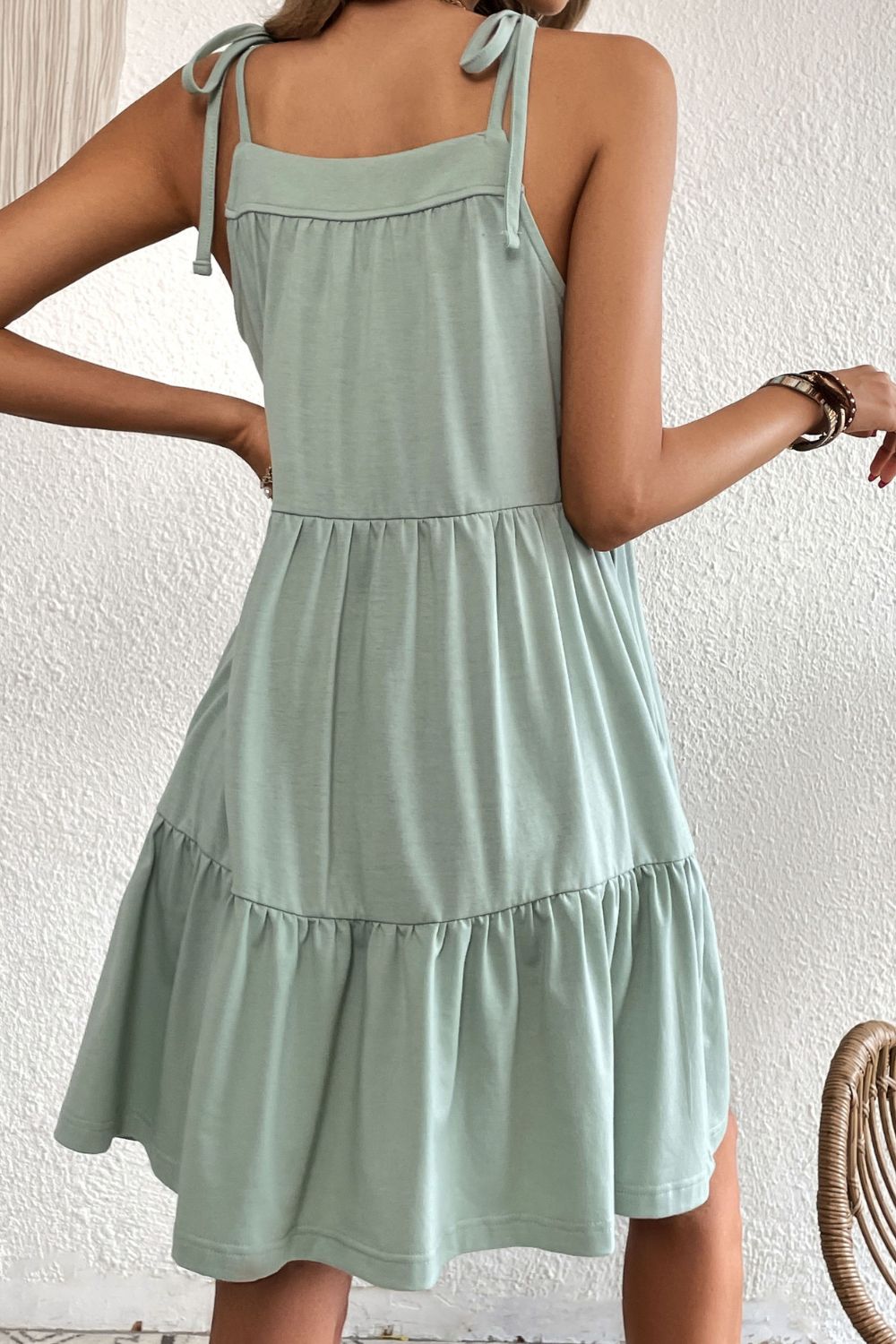 Light green tie-shoulder tiered sleeveless dress with gathered bodice and skirt