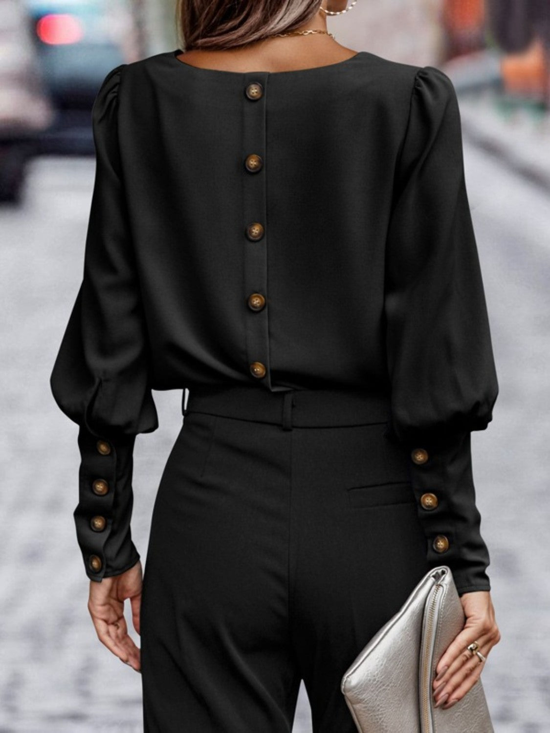 Black blouse back with button-front placket and gathered lantern sleeves