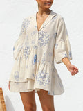 Cream printed mini dress with button-front V-neck and blue doodle pattern