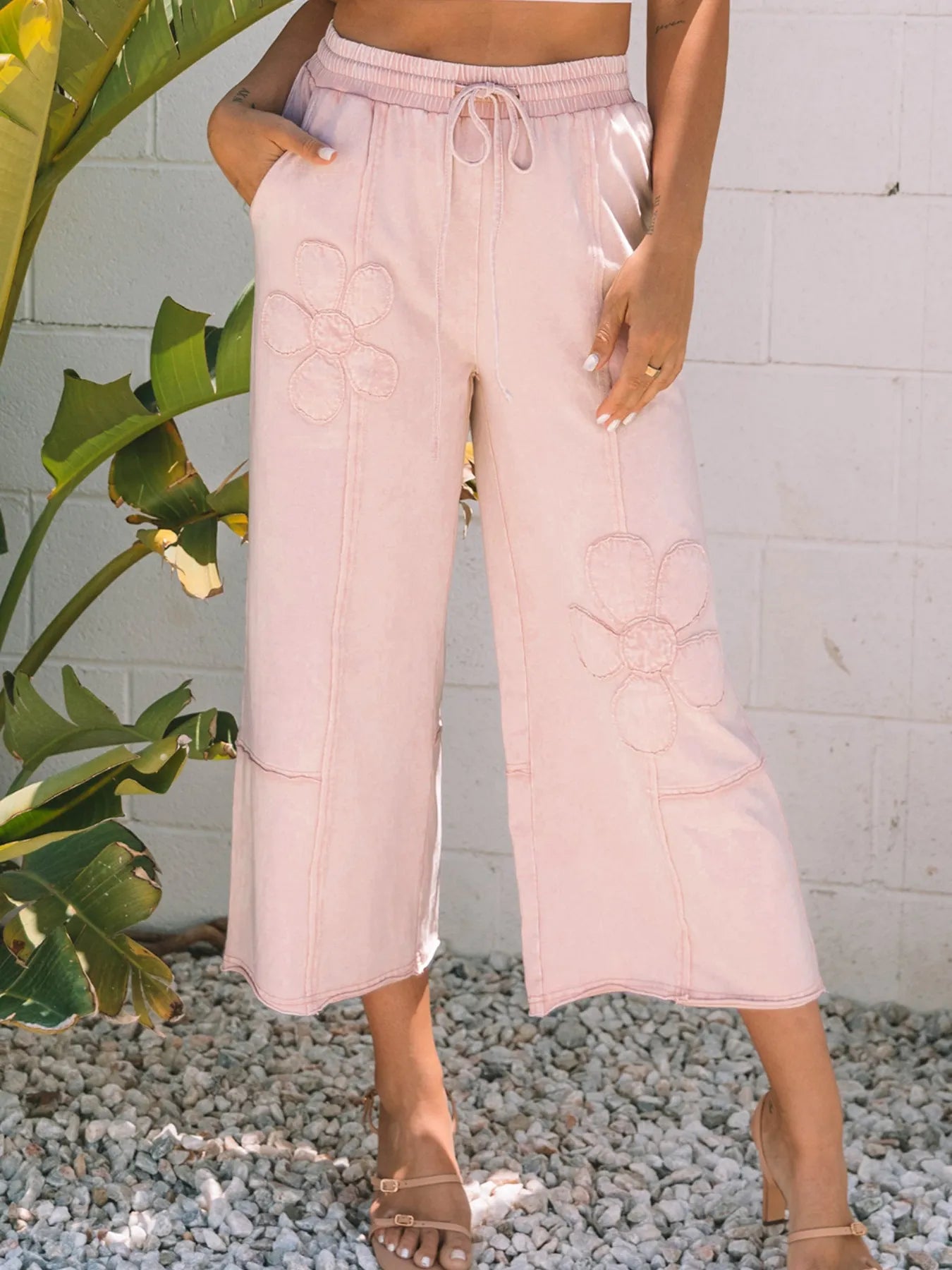 Floral wide-leg crop pants in blush pink, with drawstring waist and embroidered flowers
