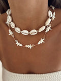 Double-layer shell charm necklace with starfish and cowrie shells, copper bead accents
