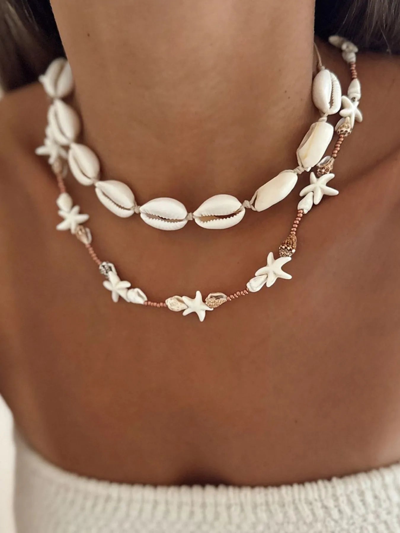 Double-layer shell charm necklace with starfish and cowrie shells, copper bead accents