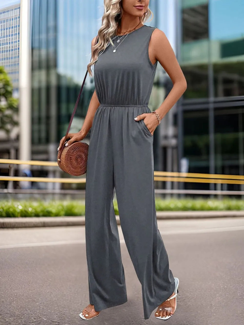 Dark gray round neck wide-leg jumpsuit, sleeveless with flowing wide legs
