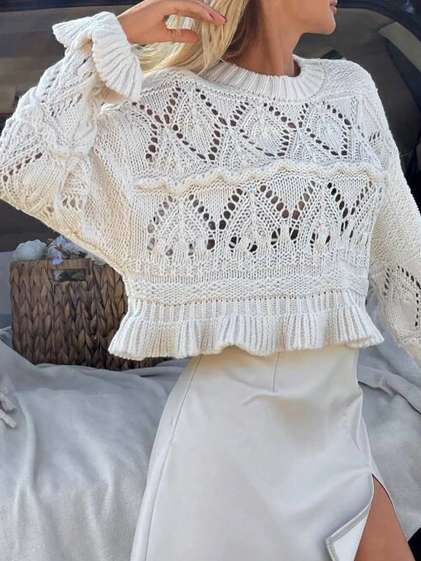 White crochet long sleeve sweater with ruffled cuff and openwork diamond stitch pattern