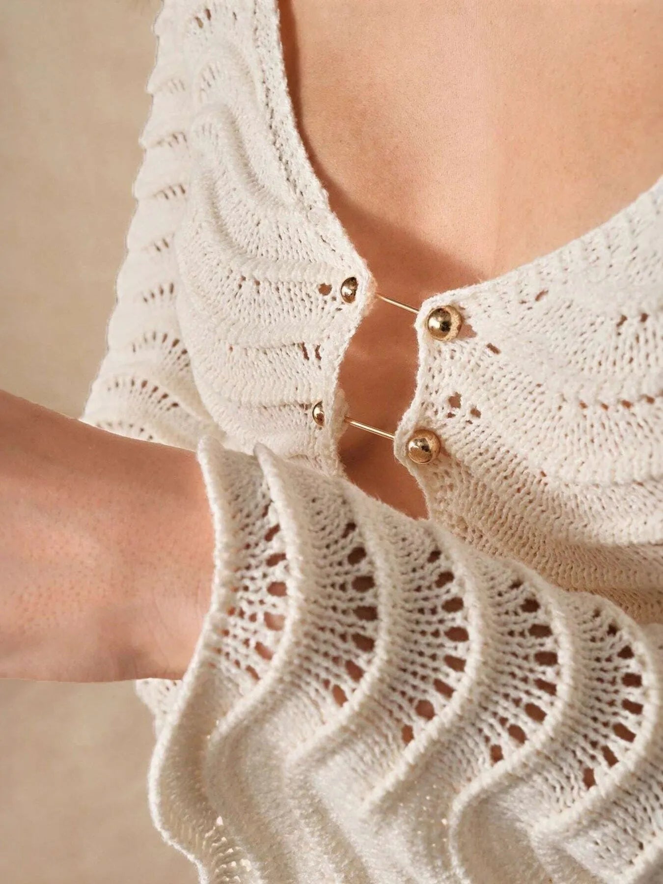 Apricot crochet dress detail: V-neck with button placket and openwork wave knit