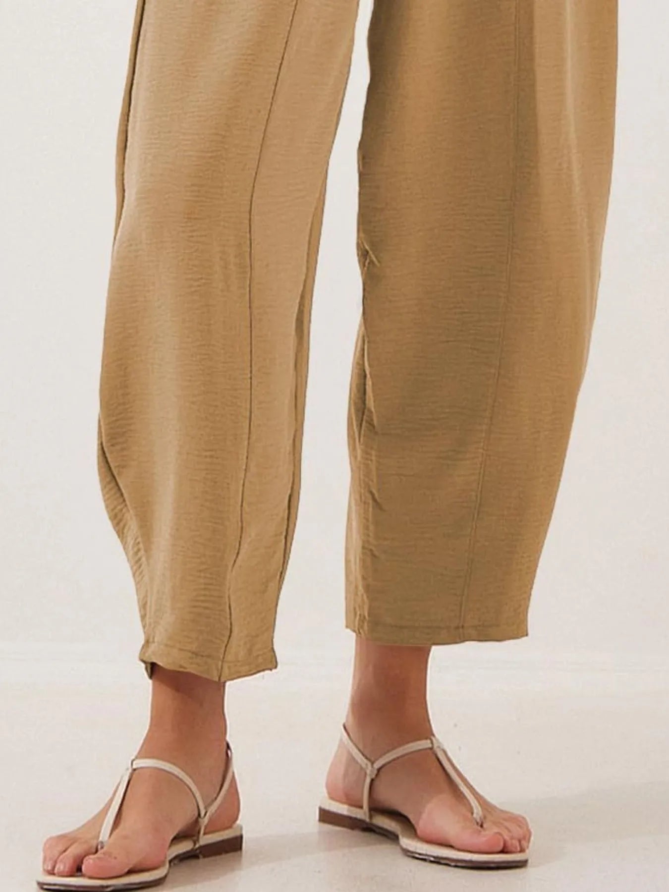 Khaki drawstring wide-leg cropped pants with elastic waistband, side seam details