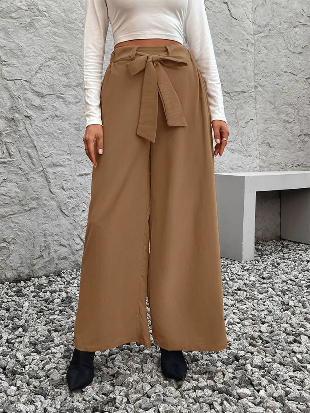 Caramel tied high-waist wide-leg pants with bow waistband, centered front