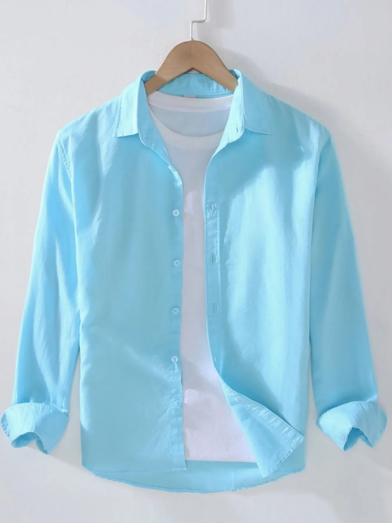 Light blue short-sleeve button-up shirt with point collar and front button placket