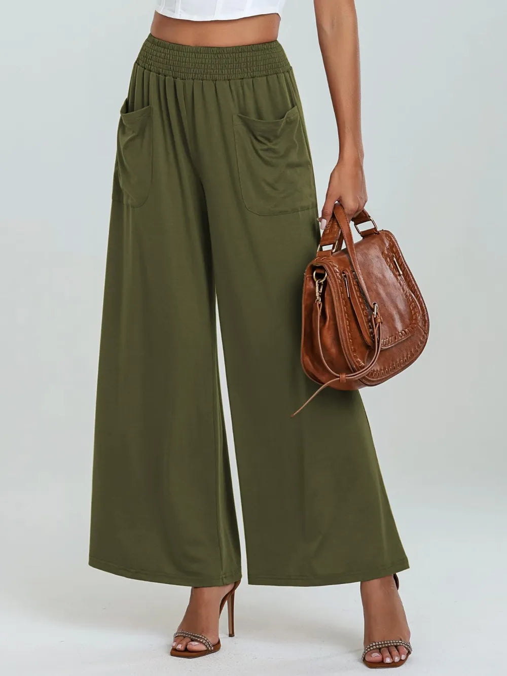 Moss green wide-leg pants with elastic waist and side pockets, cropped view from front
