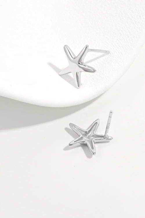 Sterling silver star stud earrings, angled view showing earring posts