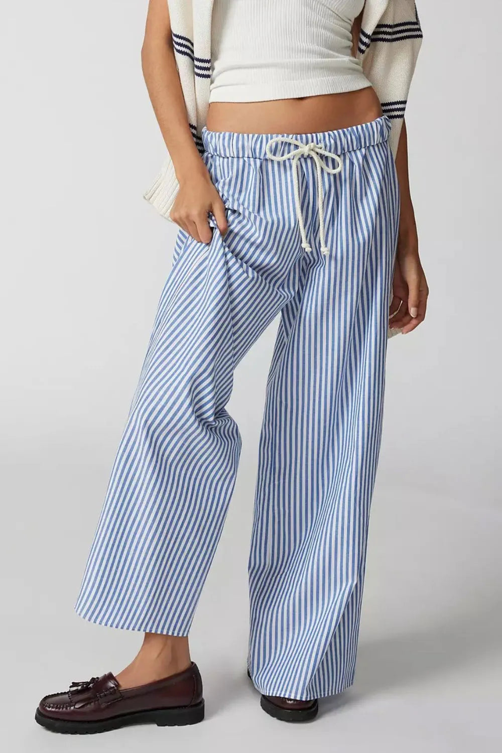 Light blue striped wide-leg pants with drawstring waist and roomy straight legs