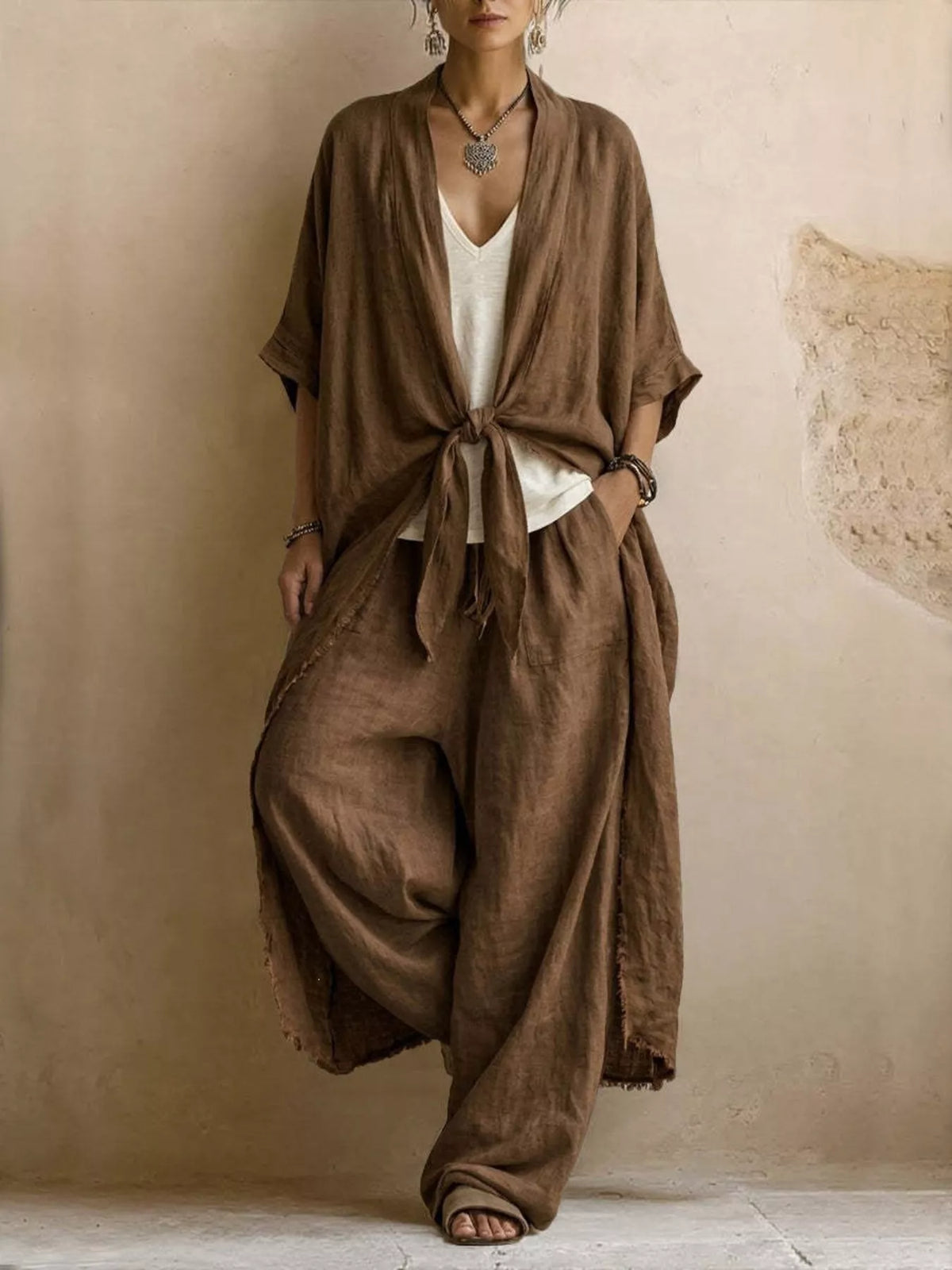 Brown tie-front cardigan and wide-leg pants set with gathered knot at waist.