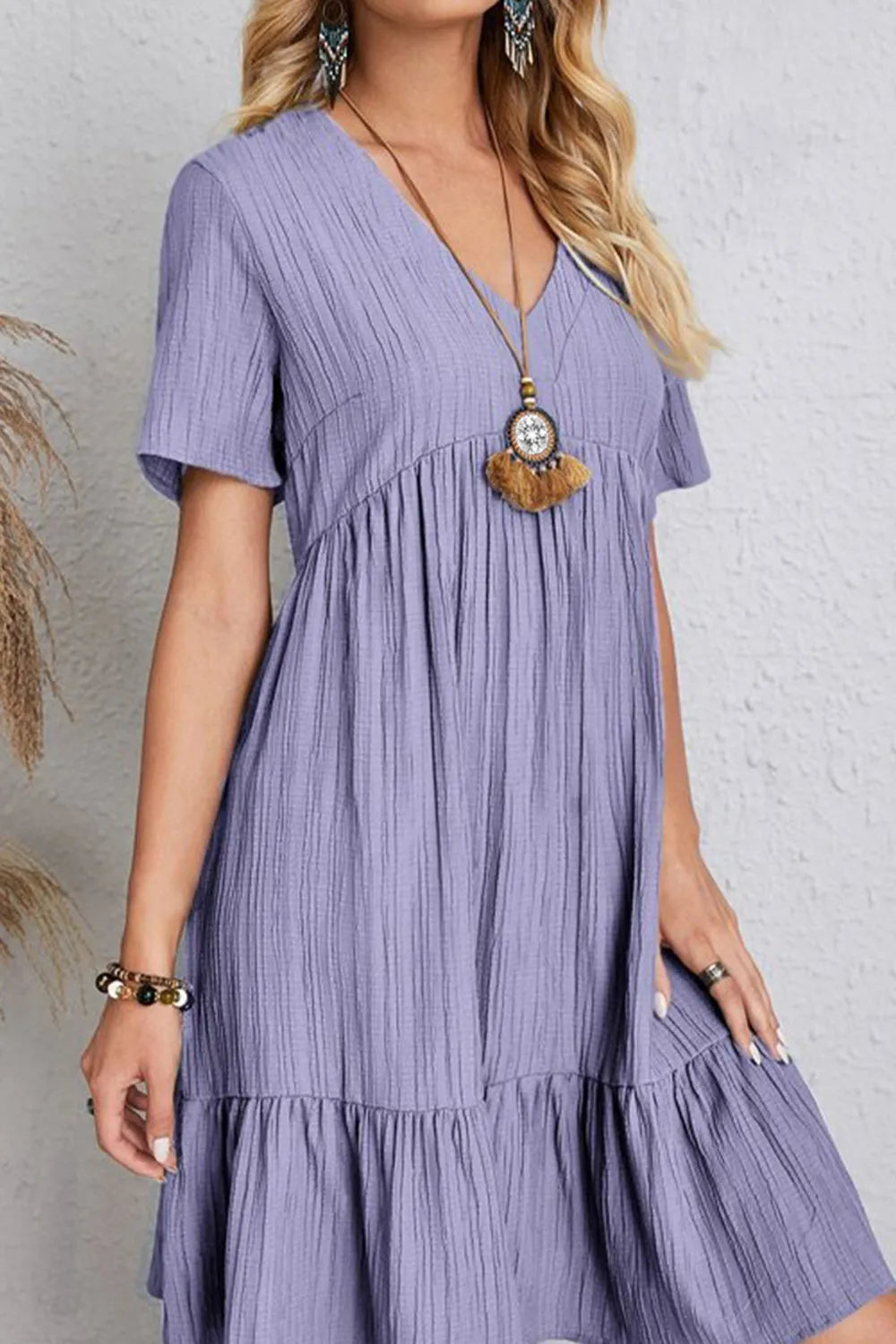 Lavender V-neck short-sleeve dress with tiered layers and ruffled skirt trim