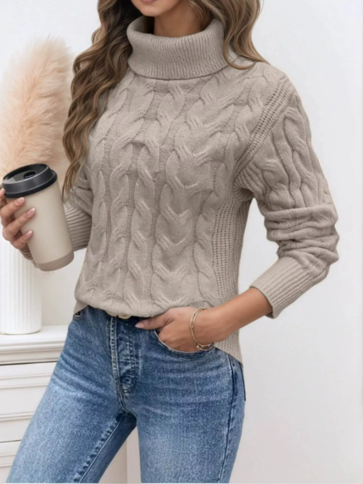 Light gray cable knit turtleneck sweater, long sleeves, ribbed cuffs and hem
