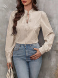 Taupe striped long sleeve blouse with tied keyhole neckline and button-front