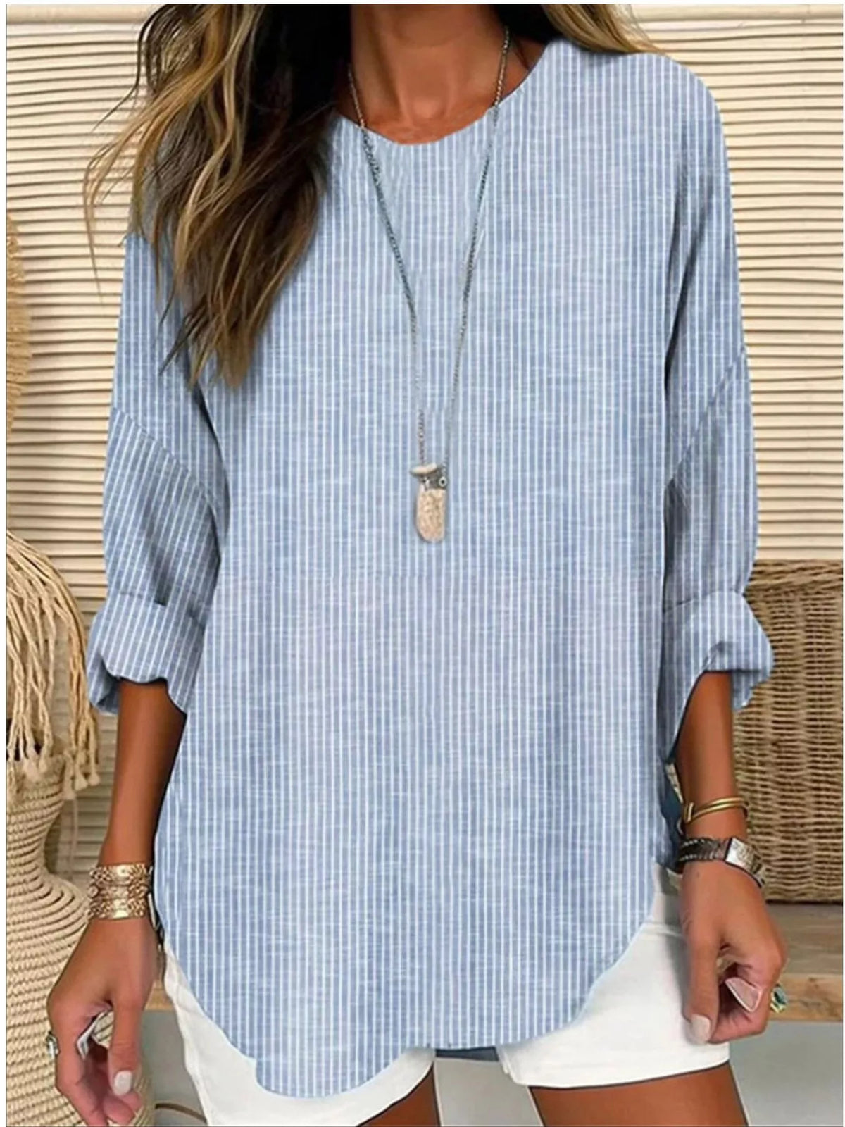 Women's striped long-sleeve blouse in light blue with split neckline