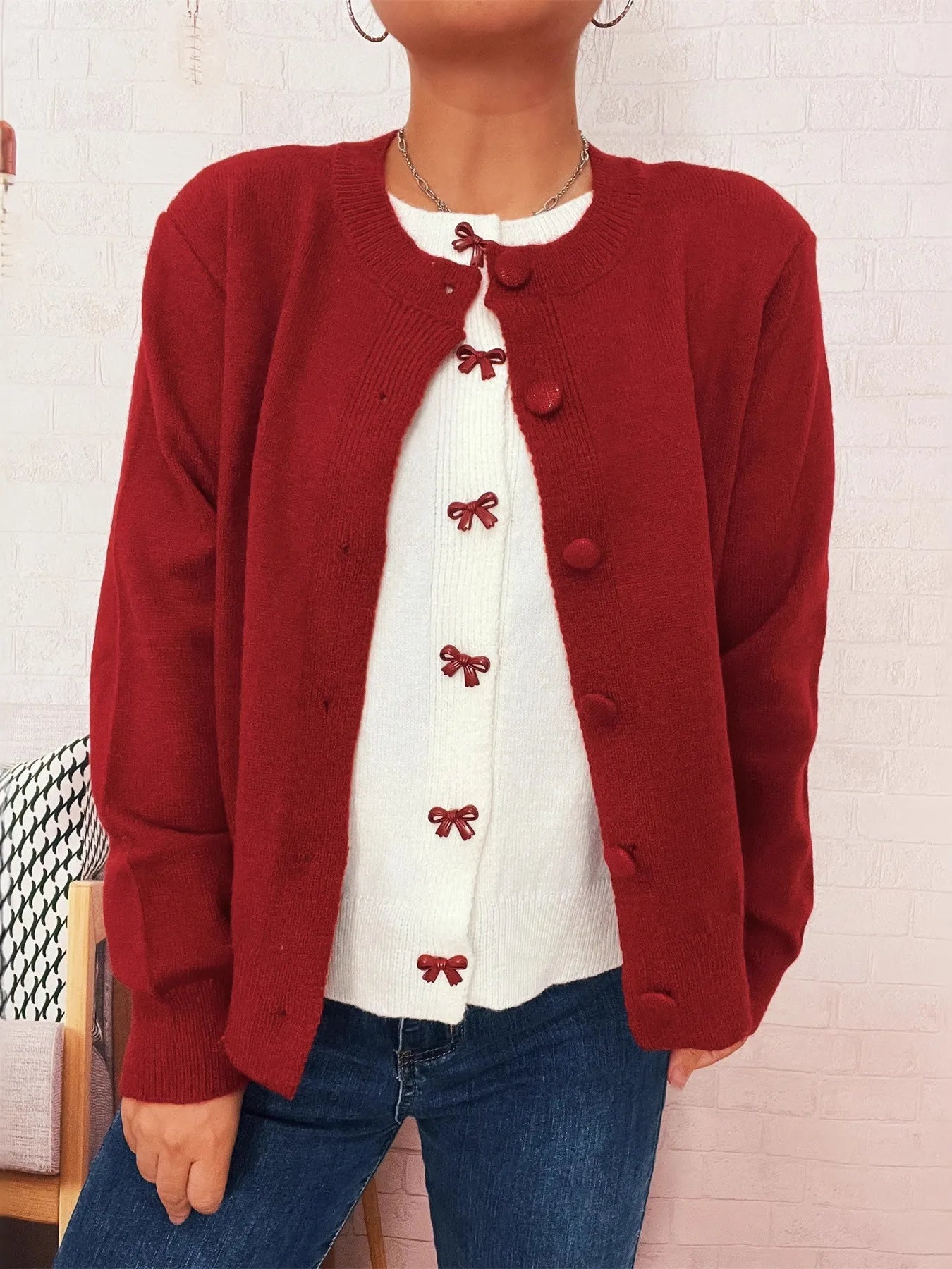 Red long-sleeve cardigan with round neck and button-front, bow embroidery on chest