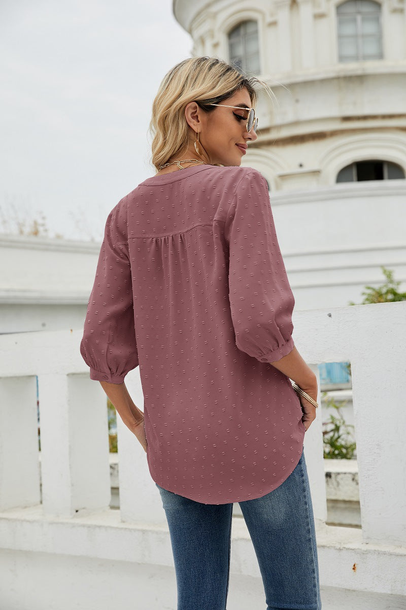 Blush pink swiss dot notched-neck blouse with 3/4 sleeves, back view