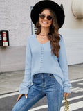 Light blue long sleeve sweater with dropped shoulders, V-neck, and vertical eyelet openwork