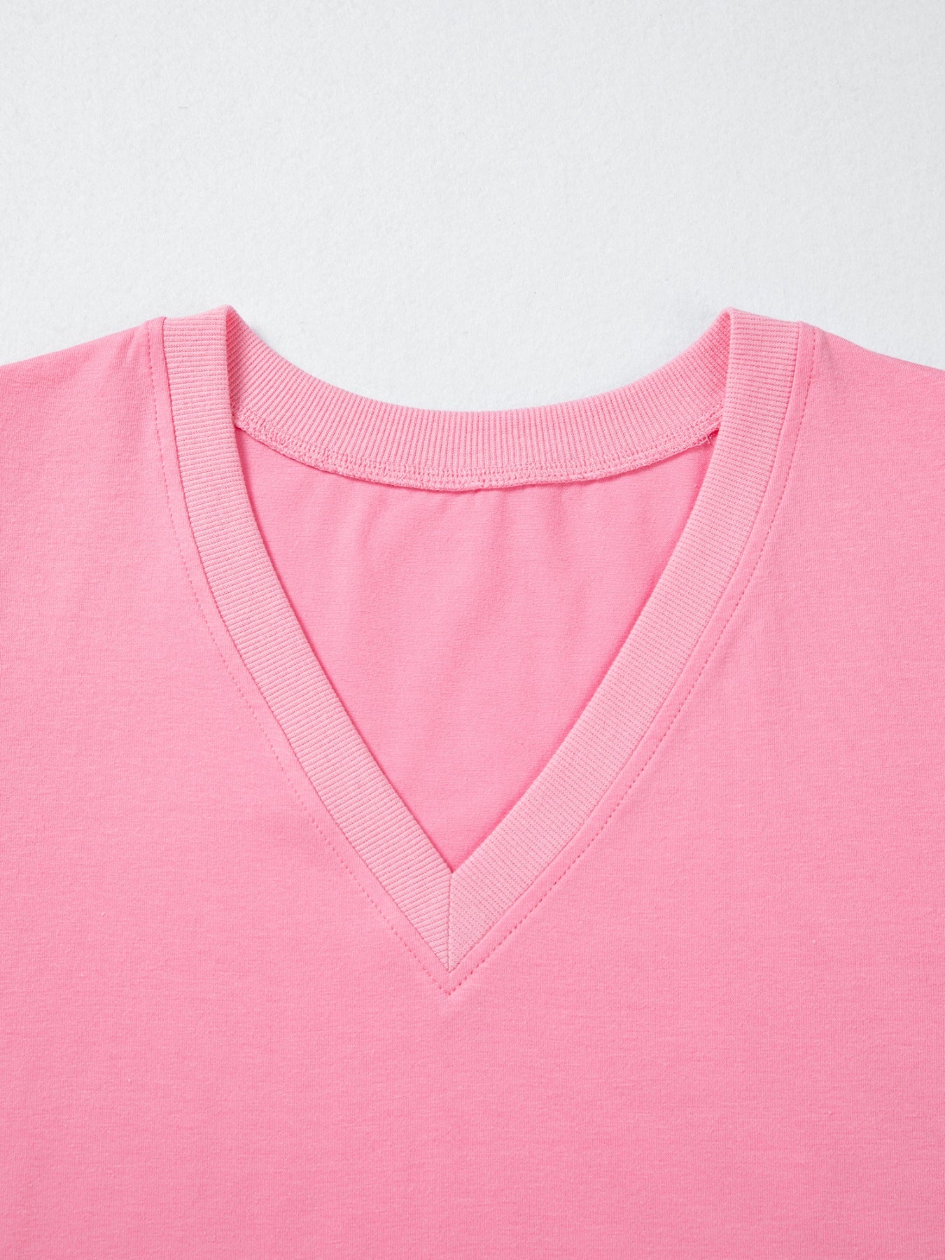 Solid pink V-neck blouse by Trendsi with ribbed trim