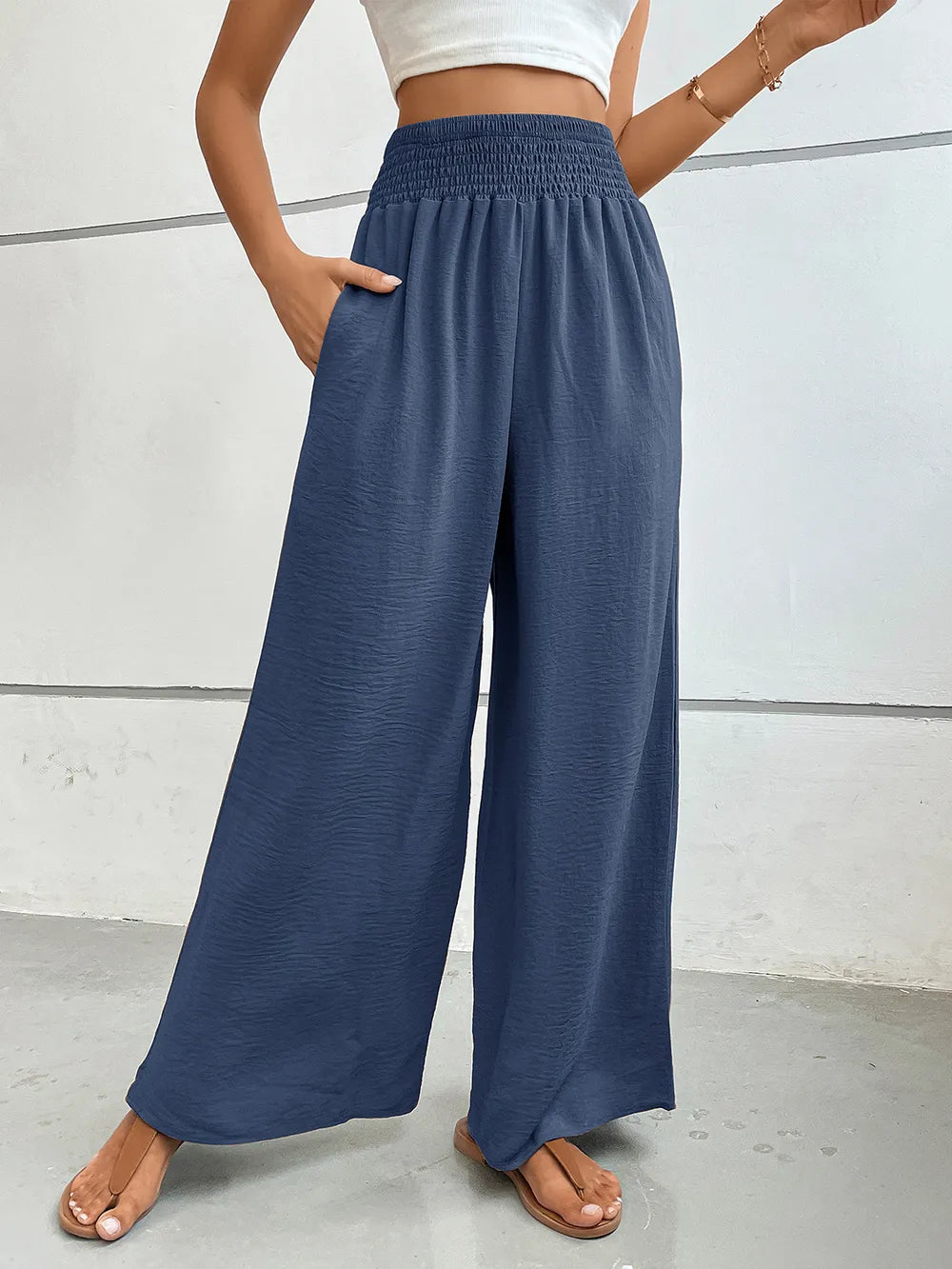 Wide-leg pants in dusty blue with elastic waistband and side pockets