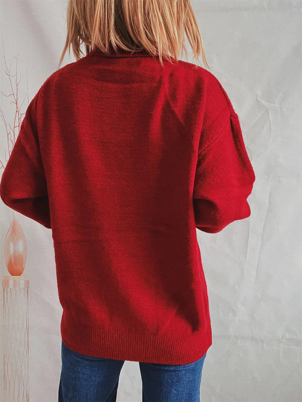 Red turtleneck long sleeve sweater with ribbed hem, back view