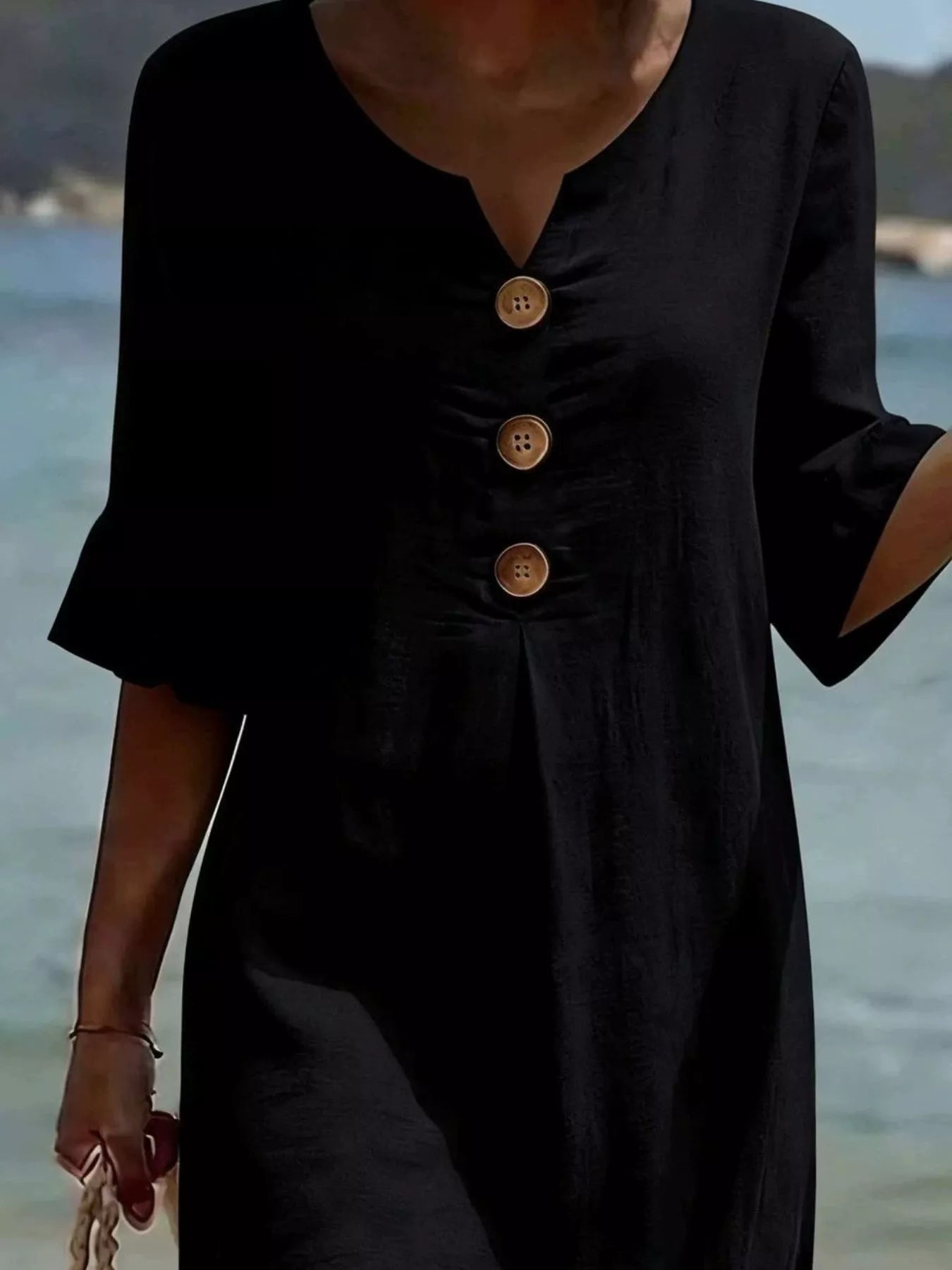 Black V-neck button-front midi dress with ruffle sleeves and three wood-tone buttons