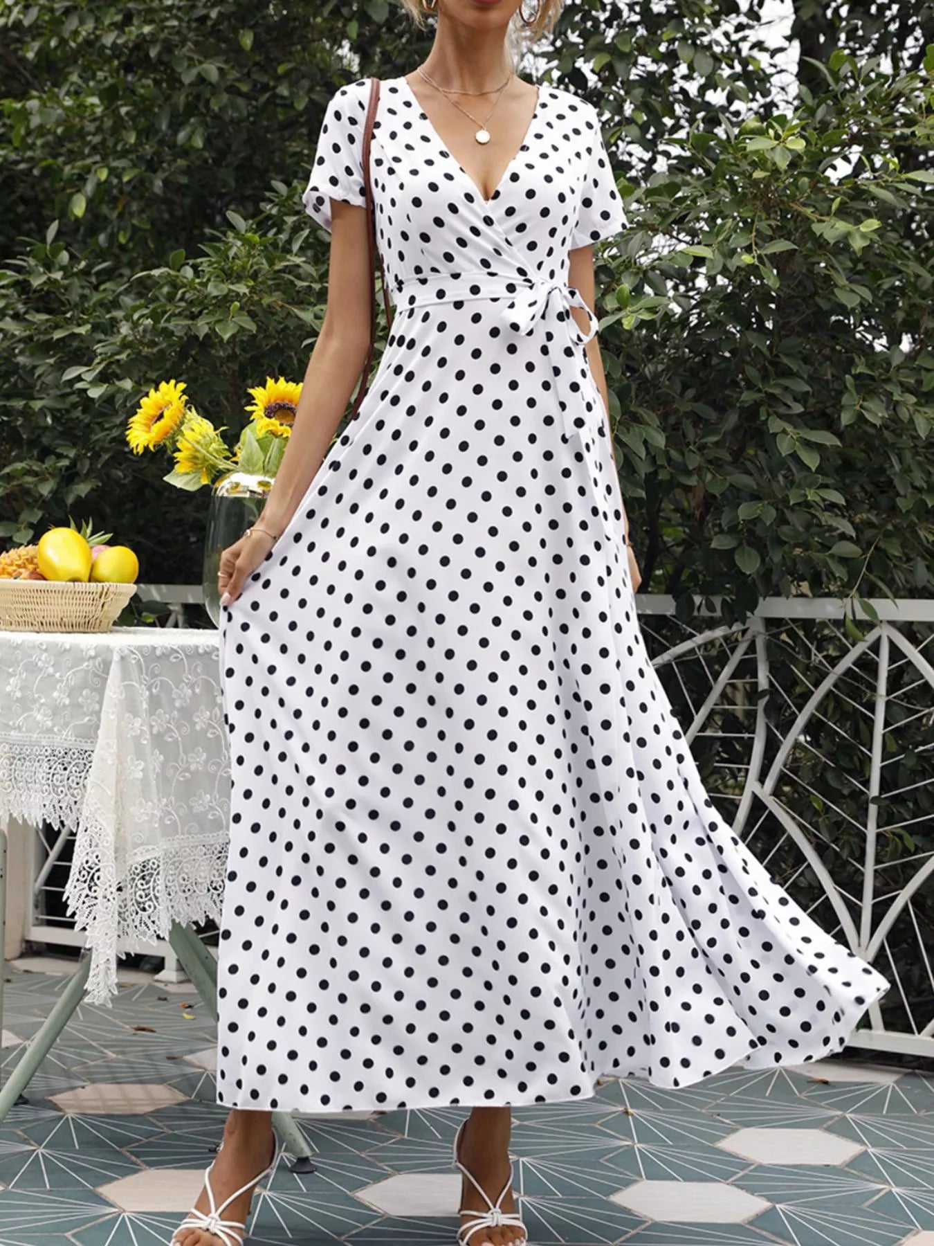 Polka-dot wrap maxi dress with belt, white with black dots, V-neck, short sleeves, full skirt
