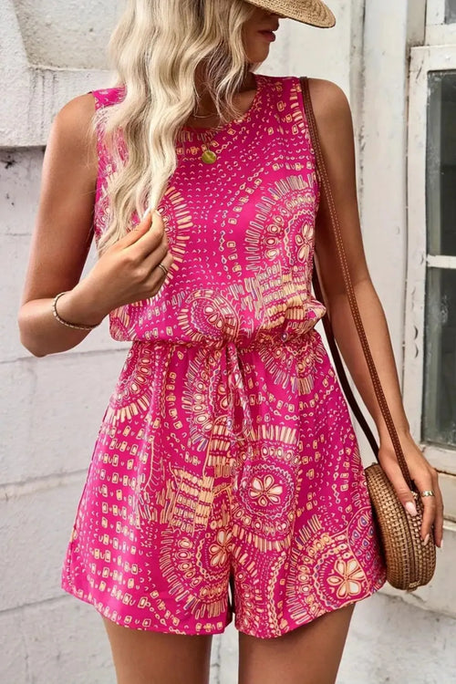 Hot pink sleeveless boho romper with ornate paisley print, tie waist