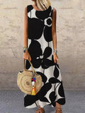 Black sleeveless maxi dress with bold floral print and side pockets, stretchy fit