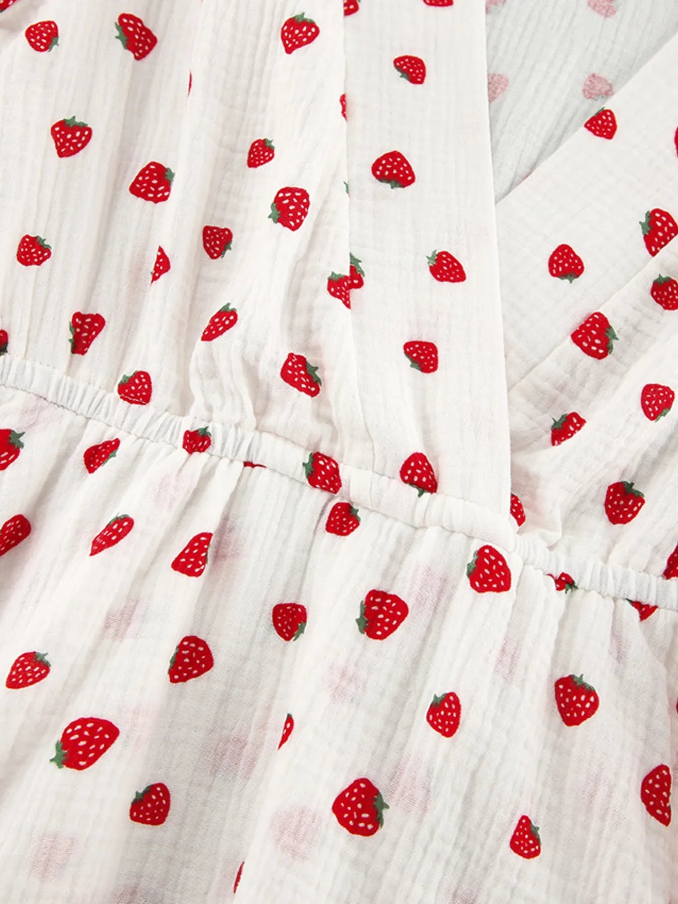 Strawberry Print Long Sleeve Mini Dress on light pink fabric with red strawberry pattern and elastic waist