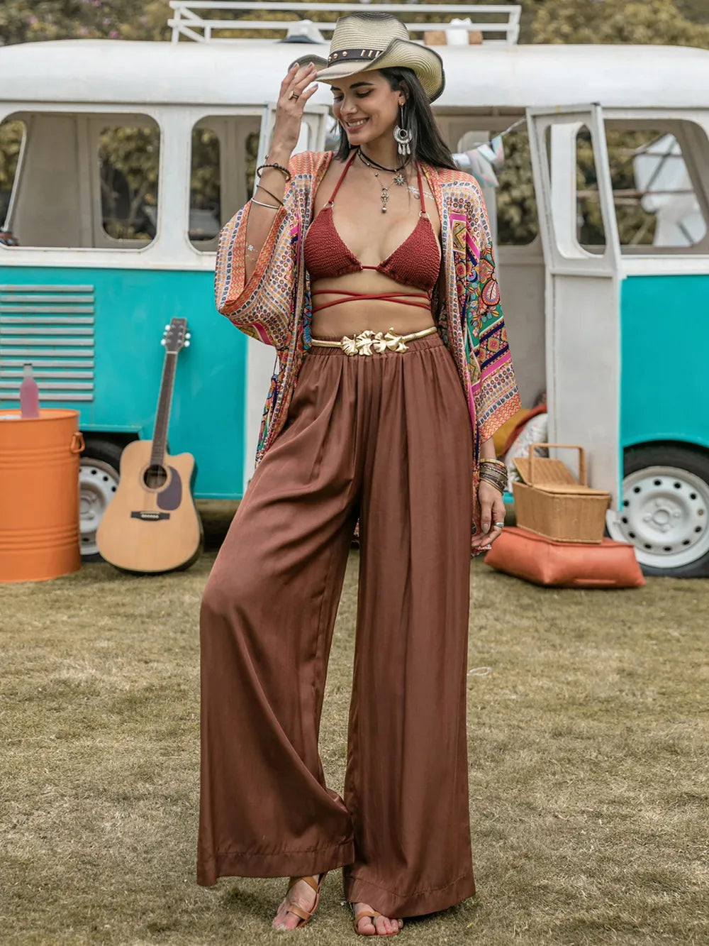 Brown high-waist wide-leg pants with gathered elastic waist and long flowy drape