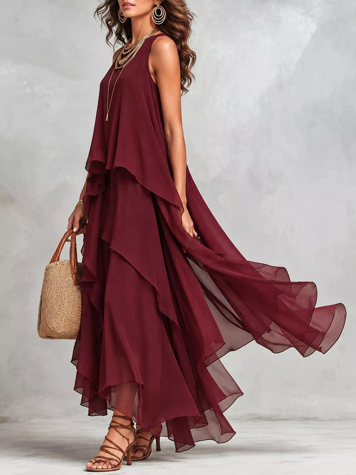 Burgundy sleeveless maxi dress with cascading ruffled tiers and sheer layered hem