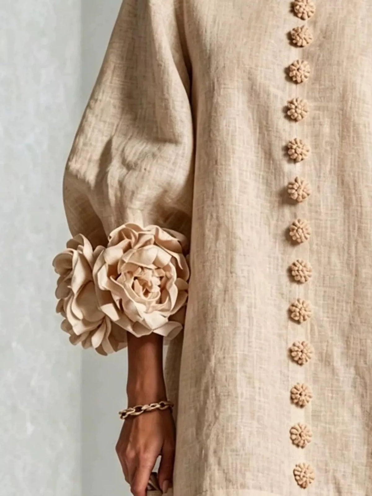 Beige round-neck polyester dress with vertical button placket and 3D floral sleeve detail