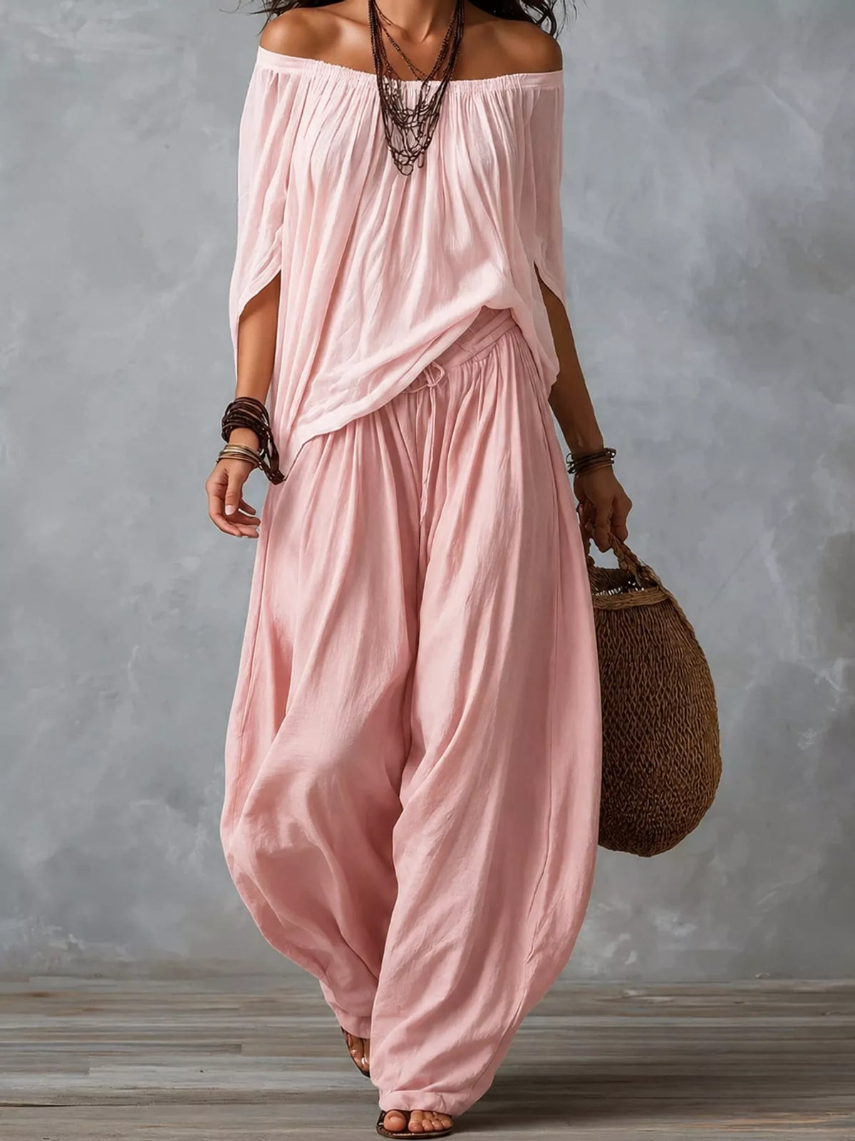 Off-shoulder harem pants set in light pink with draped top and loose balloon pants