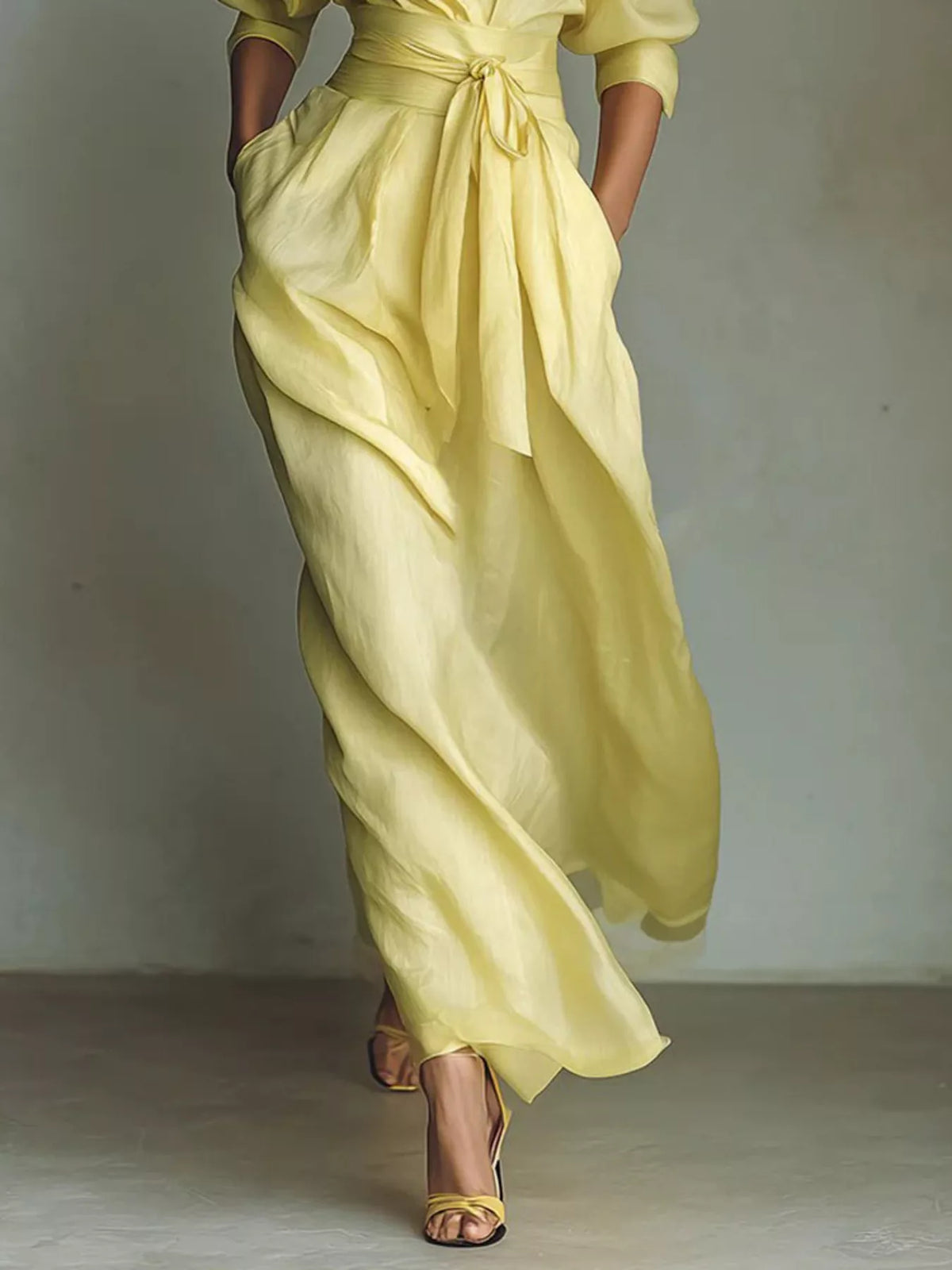 Yellow maxi shirt dress with gathered skirt and tied waist sash, puff sleeves