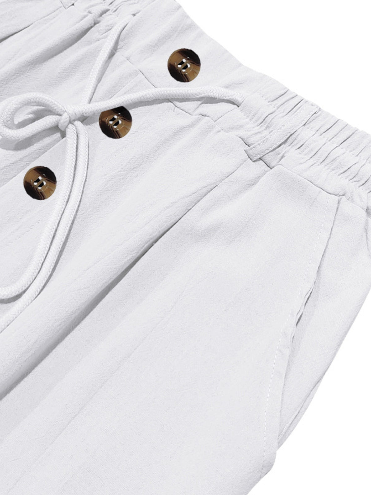 White pants front detail: drawstring with gold-tone buttons and elastic waistband